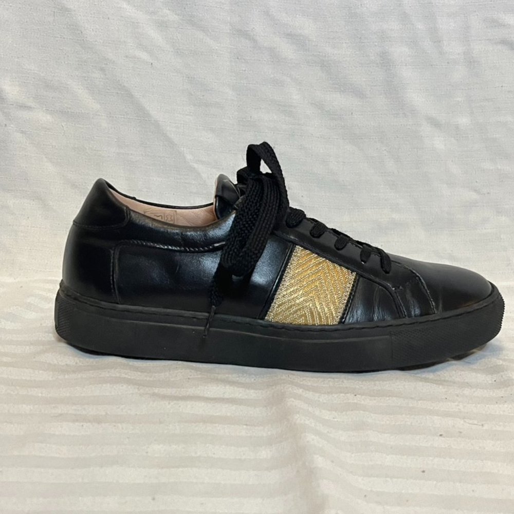 Black and gold sneakers